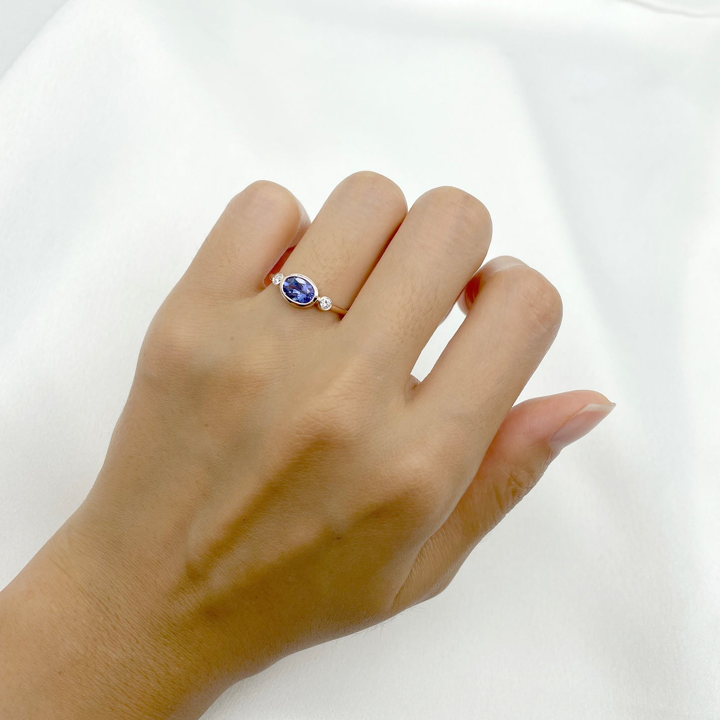 14K OVAL TANZANITE DIAMOND BEZEL RING