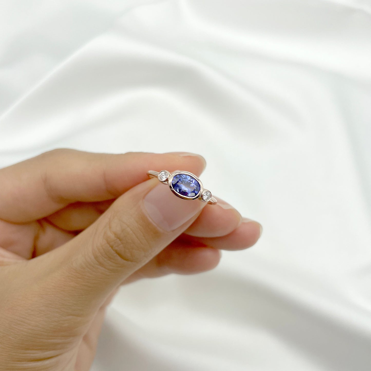 14K OVAL TANZANITE DIAMOND BEZEL RING