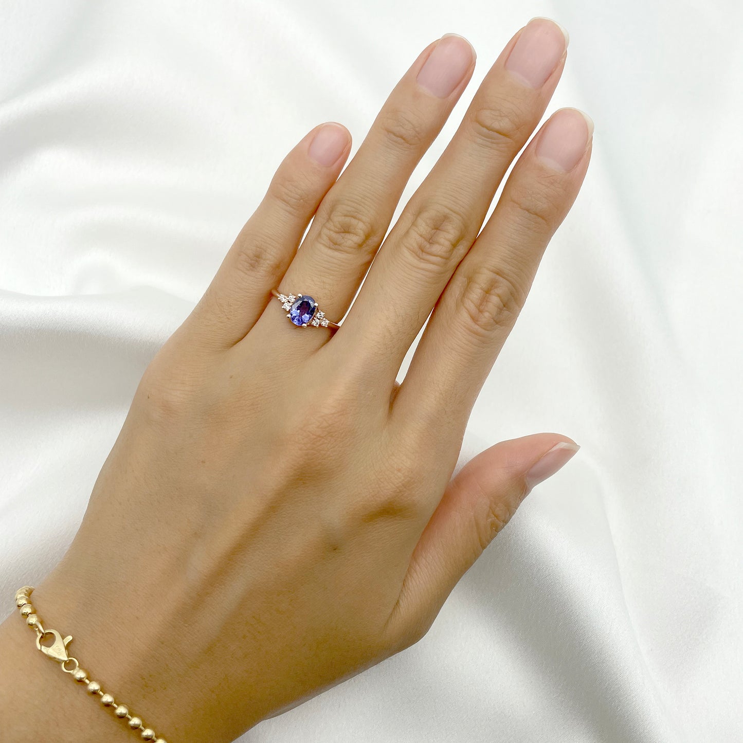 14K OVAL TANZANITE DIAMOND CLUSTER RING