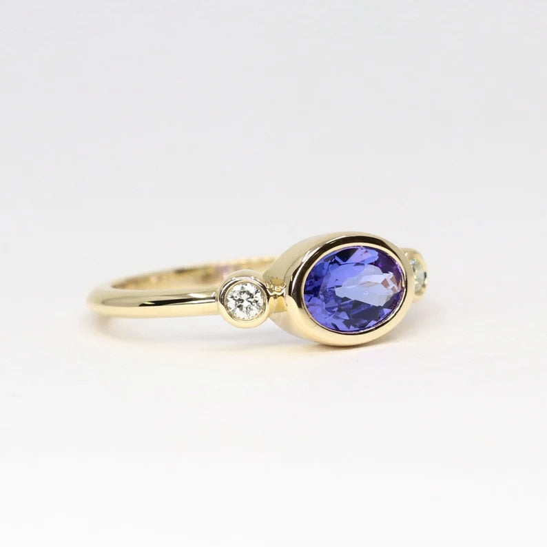 14K OVAL TANZANITE DIAMOND BEZEL RING
