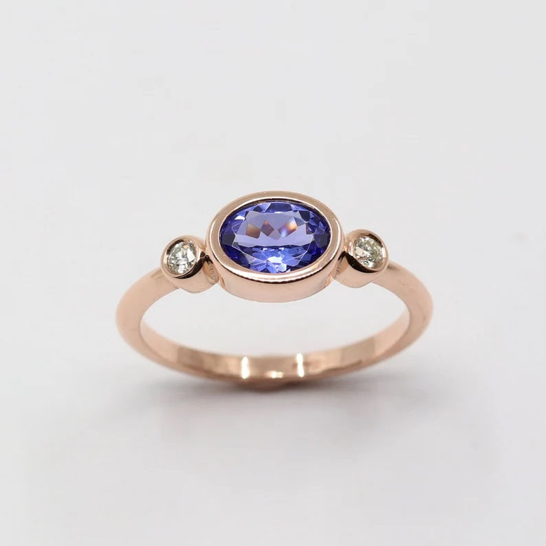 14K OVAL TANZANITE DIAMOND BEZEL RING