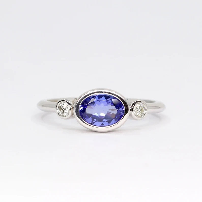 14K OVAL TANZANITE DIAMOND BEZEL RING