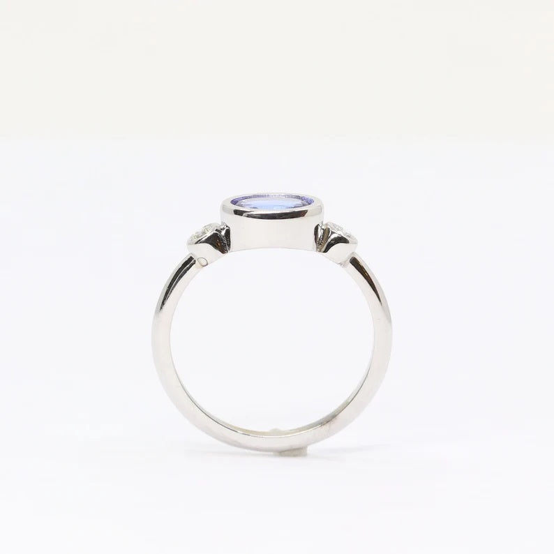 14K OVAL TANZANITE DIAMOND BEZEL RING