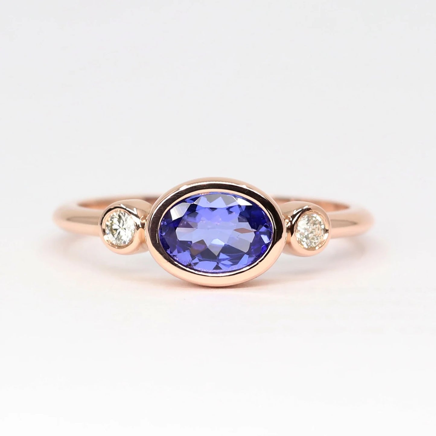 14K OVAL TANZANITE DIAMOND BEZEL RING
