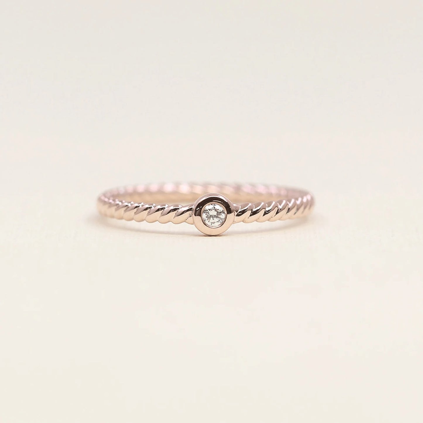 14K 0.05CT DIAMOND BEZEL TWIST RING