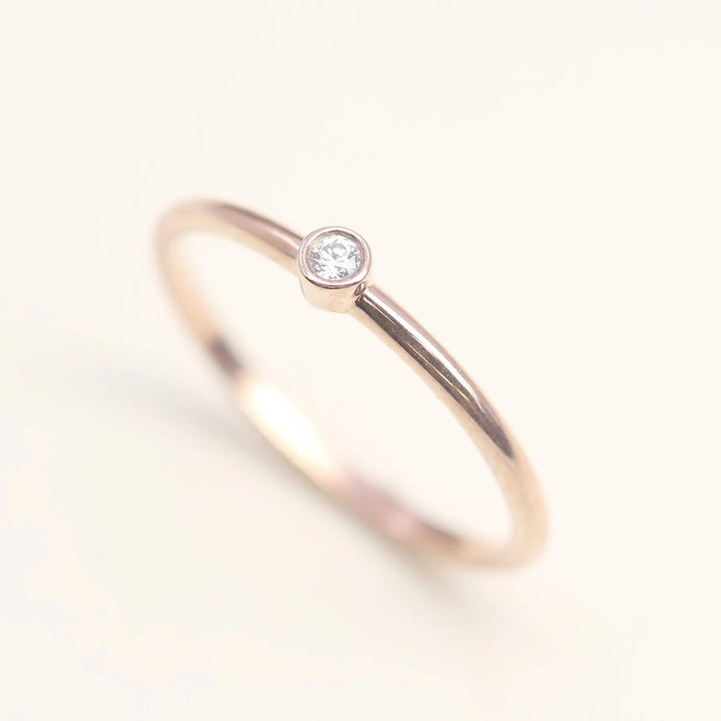 14K 0.03CT DIAMOND BEZEL SOLITAIRE RING