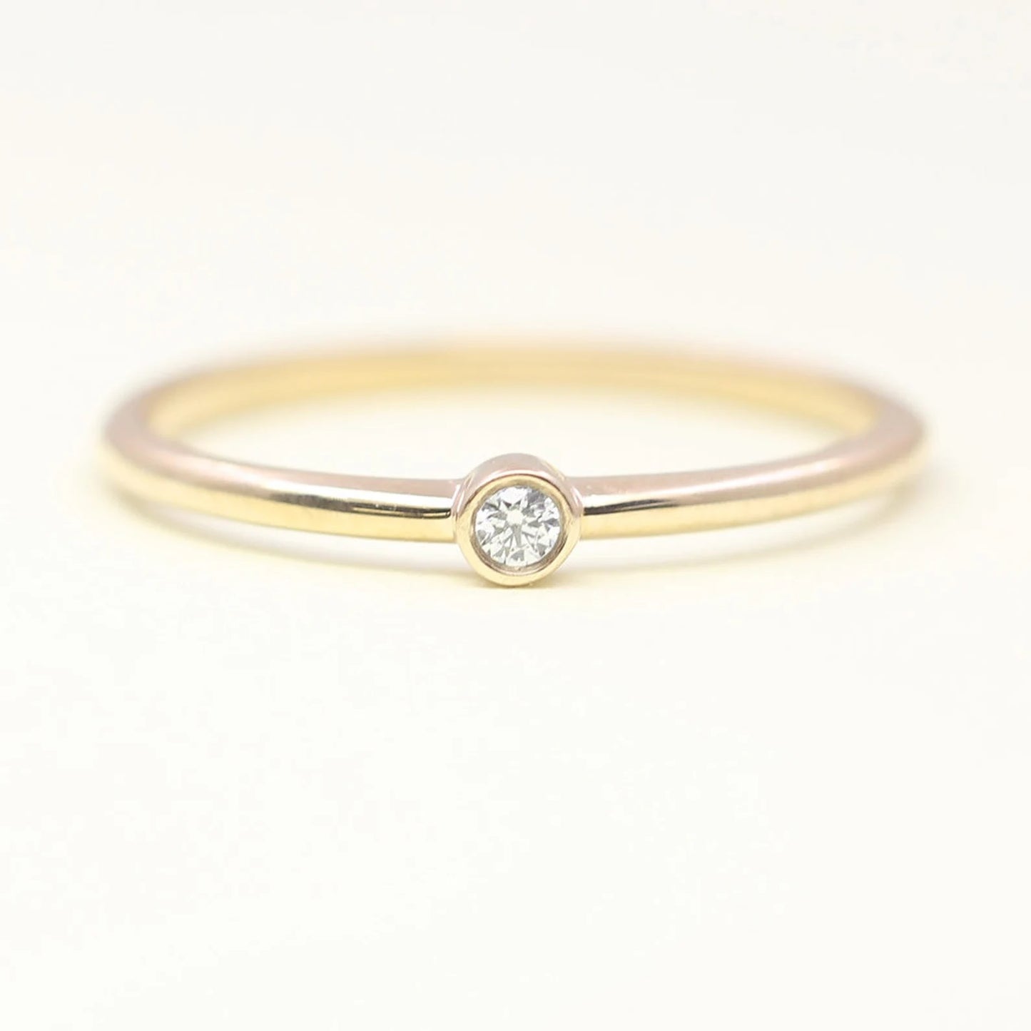 14K 0.03CT DIAMOND BEZEL SOLITAIRE RING