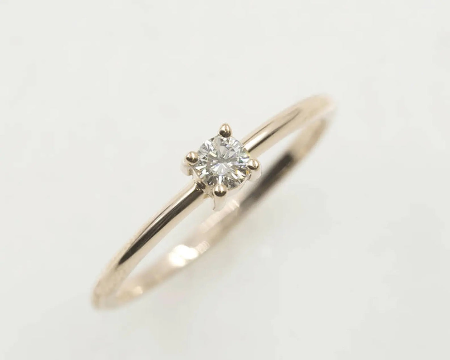 14K 0.15CT DIAMOND SOLITAIRE RING