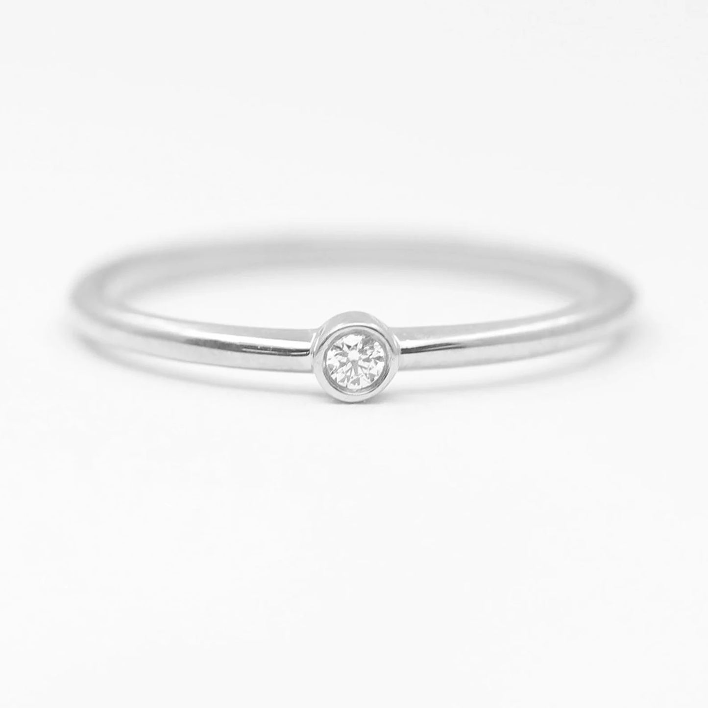 14K 0.03CT DIAMOND BEZEL SOLITAIRE RING