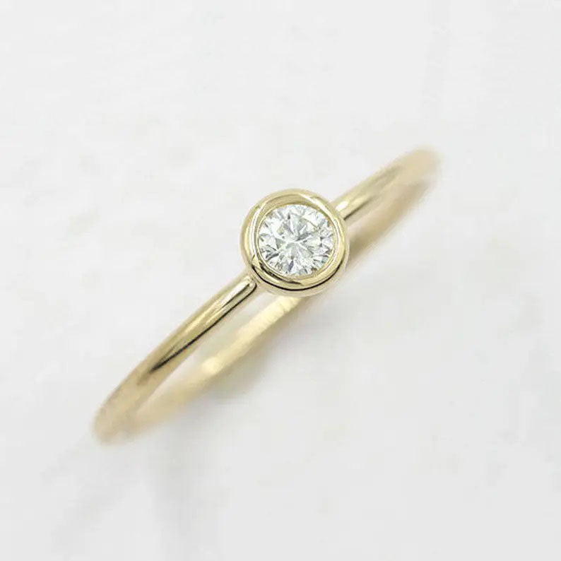 14K 0.12CT DIAMOND BEZEL SOLITAIRE RING
