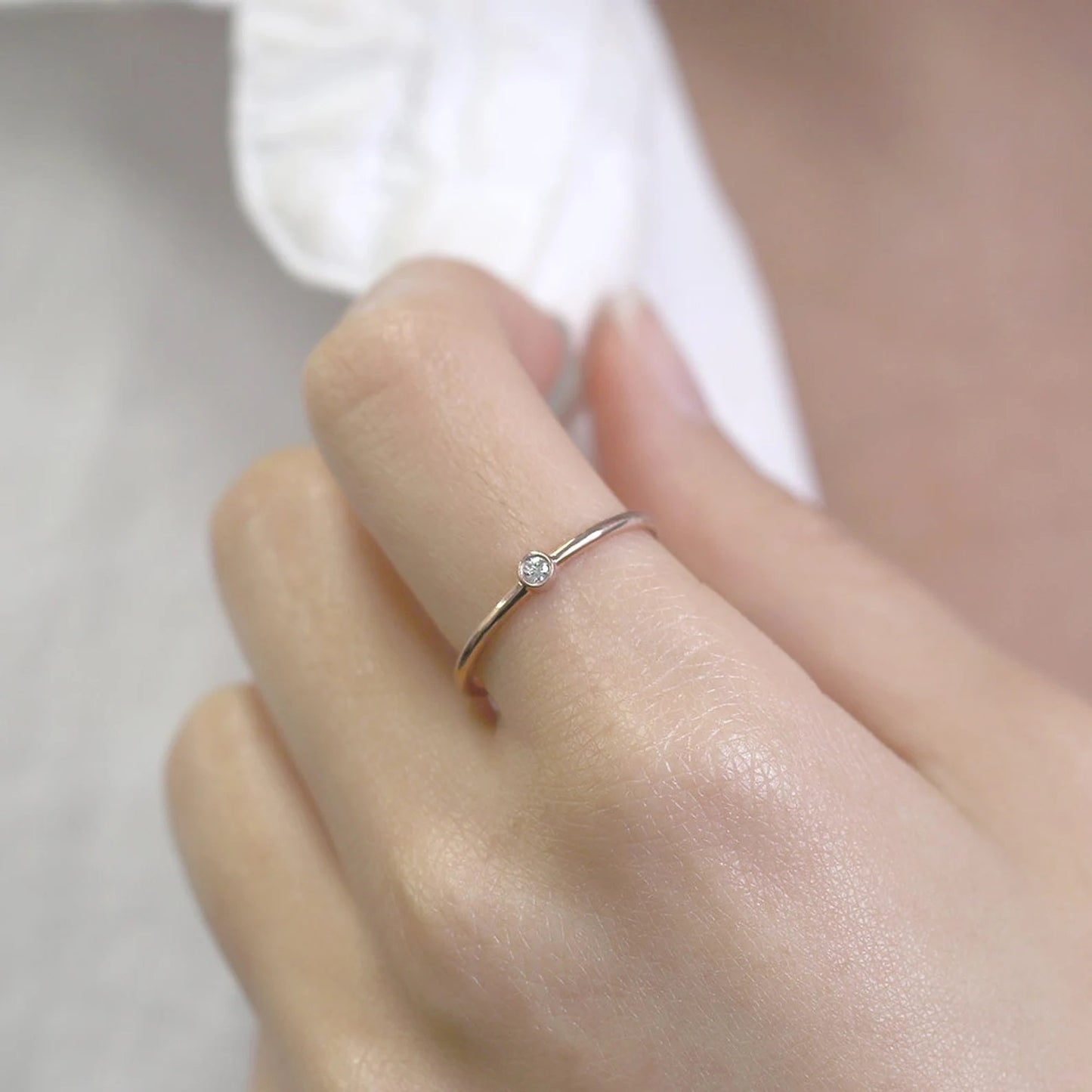 14K 0.03CT DIAMOND BEZEL SOLITAIRE RING