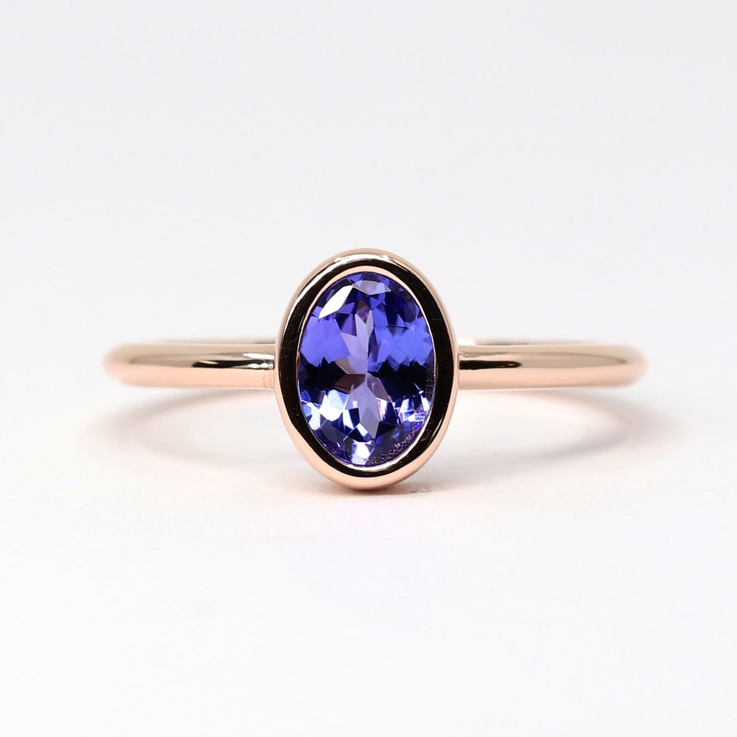 14K OVAL TANZANITE BEZEL SOLITAIRE RING