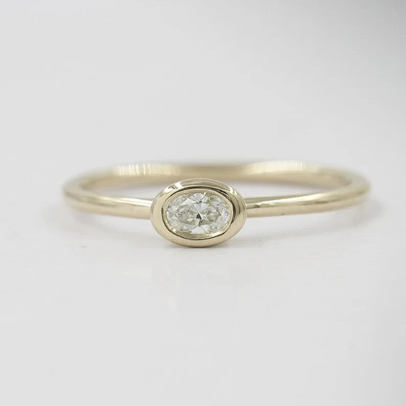 14K 0.15CT OVAL DIAMOND BEZEL SOLITAIRE RING