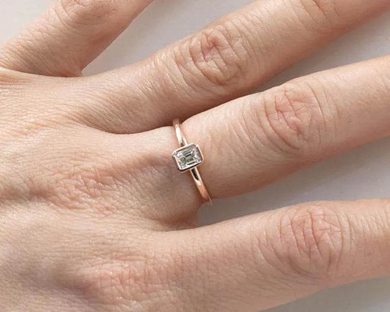 14K 0.30CT EMERALD CUT DIAMOND BEZEL SOLITAIRE RING