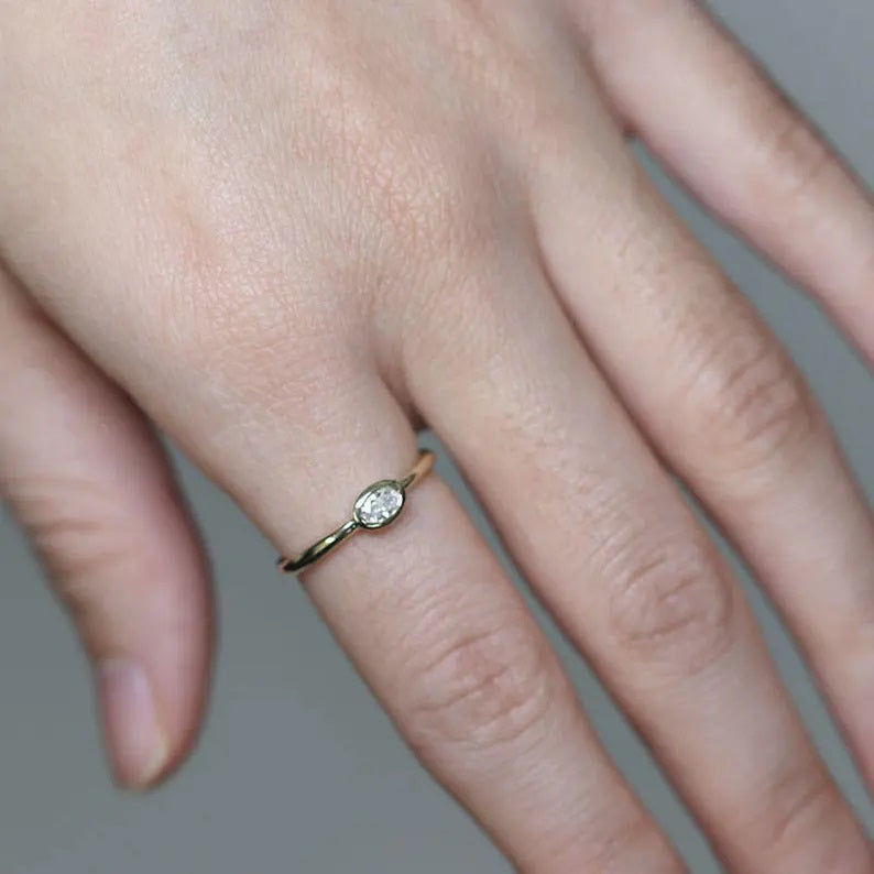 14K 0.15CT OVAL DIAMOND BEZEL SOLITAIRE RING
