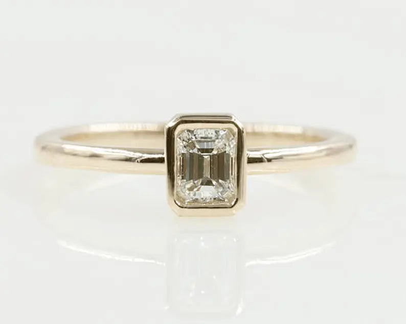 14K 0.30CT EMERALD CUT DIAMOND BEZEL SOLITAIRE RING