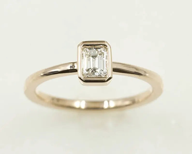 14K 0.30CT EMERALD CUT DIAMOND BEZEL SOLITAIRE RING
