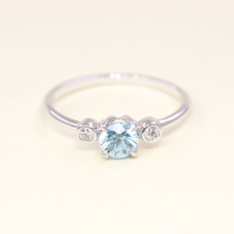 14K BLUE ZIRCON DIAMOND BEZEL RING