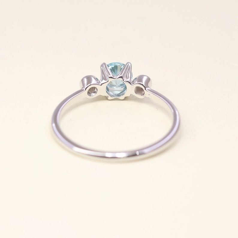 14K BLUE ZIRCON DIAMOND BEZEL RING