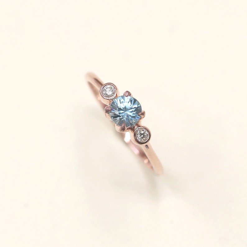 14K BLUE ZIRCON DIAMOND BEZEL RING