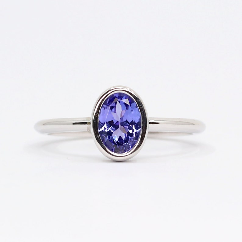 14K OVAL TANZANITE BEZEL SOLITAIRE RING