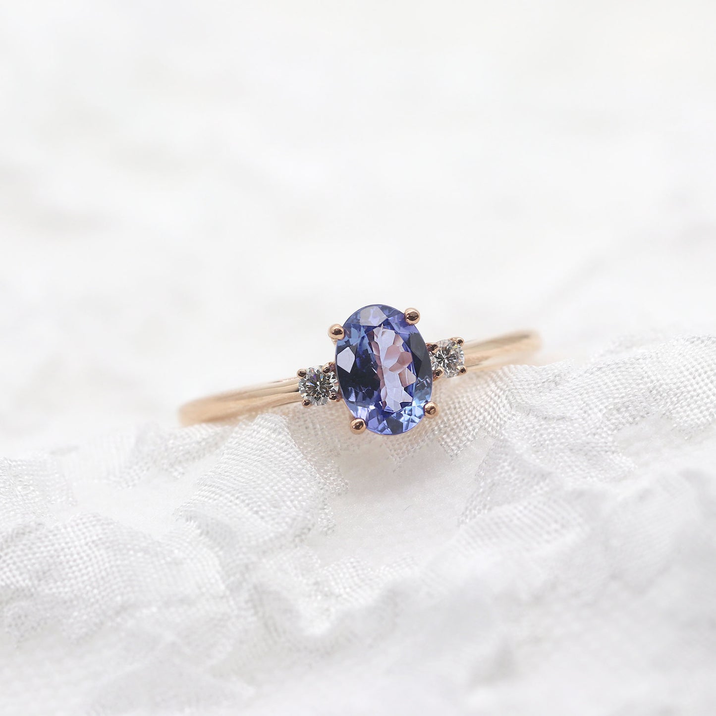 14K OVAL TANZANITE 0.06CT DIAMOND RING