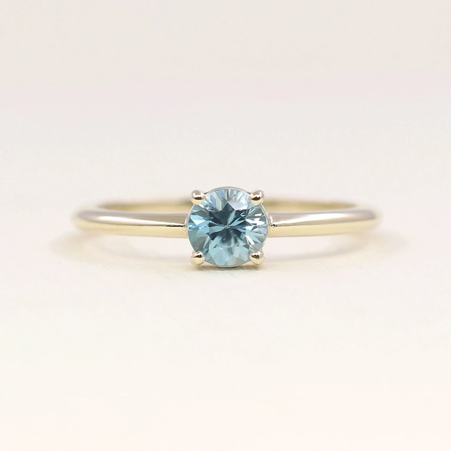 14K ROUND BLUE ZIRCON SOLITAIRE RING