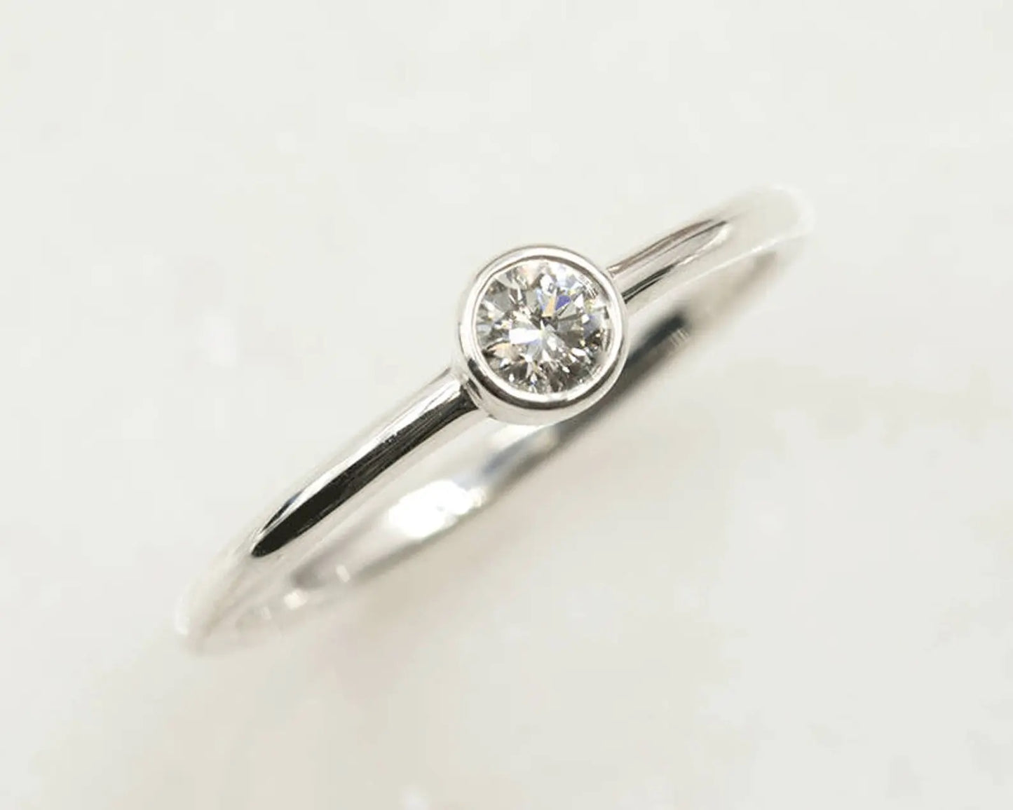 14K 0.15CT DIAMOND BEZEL SOLITAIRE RING