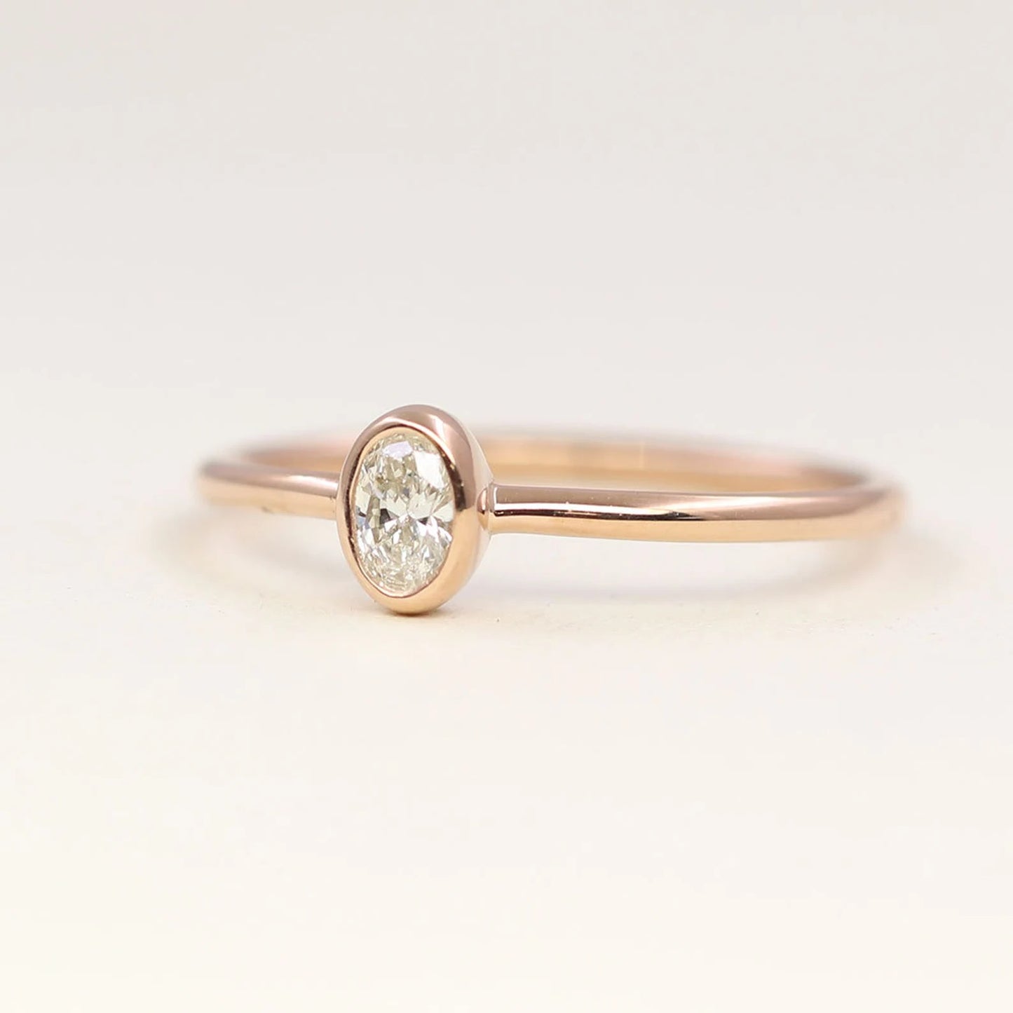 14K 0.15CT OVAL DIAMOND BEZEL SOLITAIRE RING