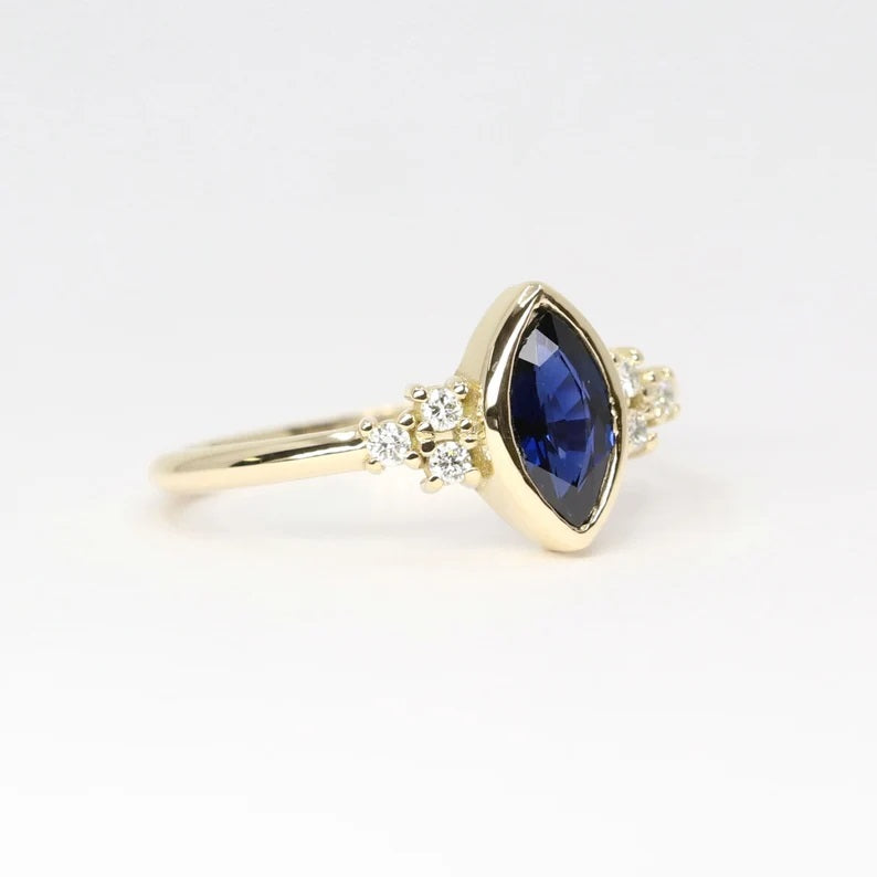 14K MARQUISE SAPPHIRE BEZEL 0.10CT DIAMOND RING