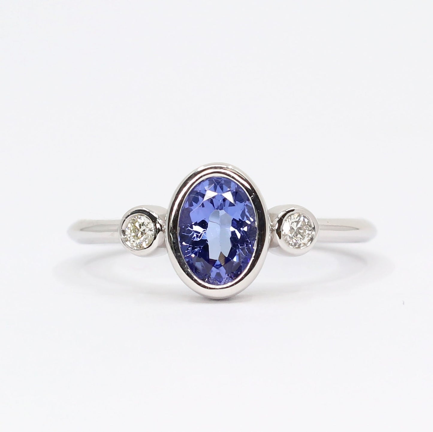 14K OVAL TANZANITE DIAMOND BEZEL RING