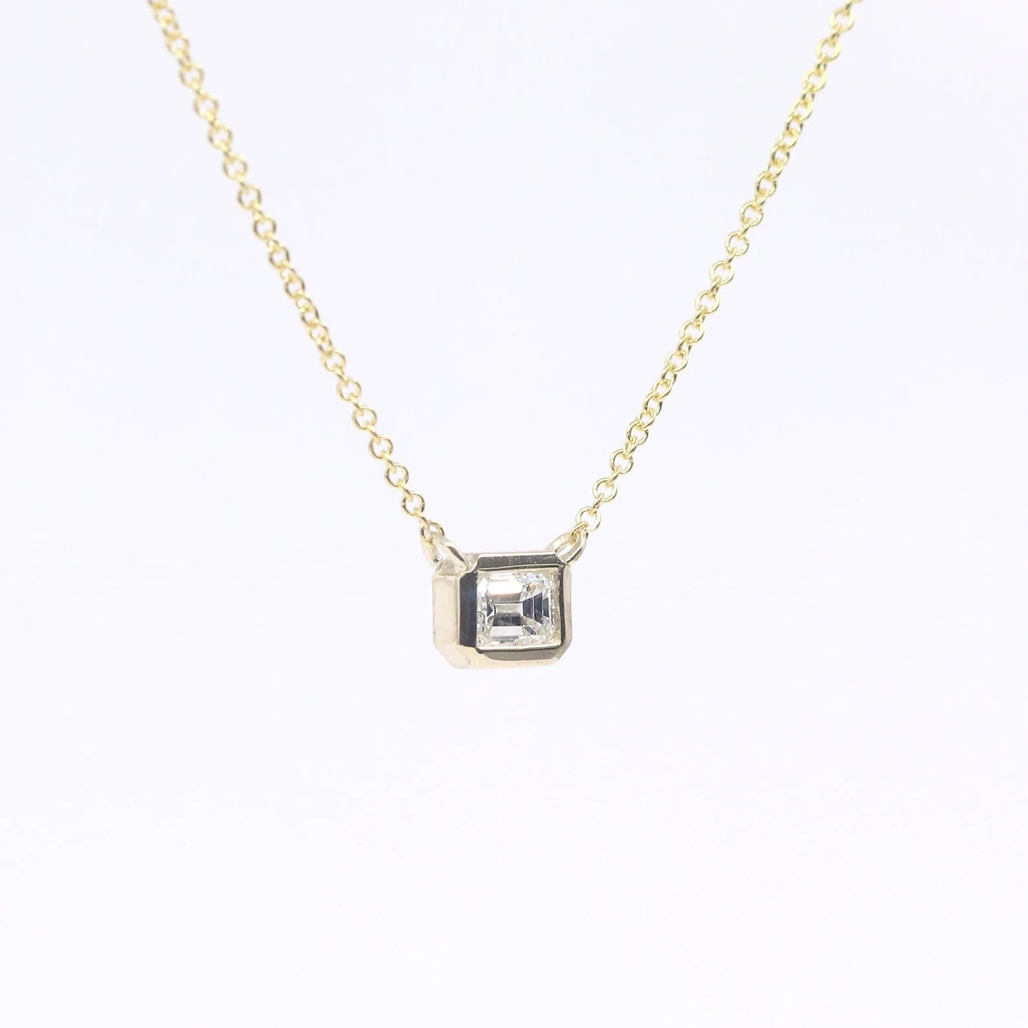 14K 0.25CT EMERALD CUT DIAMOND BEZEL NECKLACE