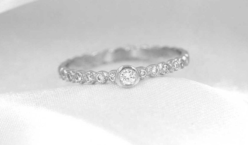 14K 0.15CT DIAMOND BEZEL BEADED RING