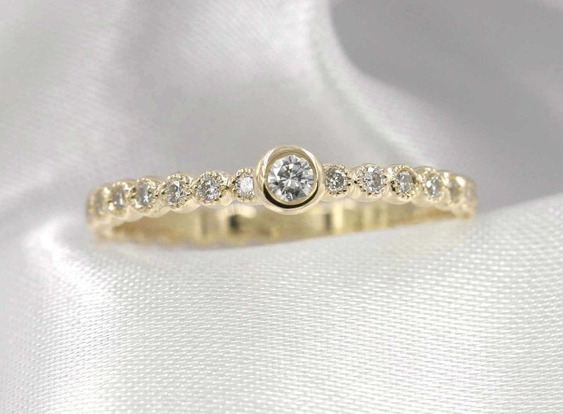 14K 0.15CT DIAMOND BEZEL BEADED RING