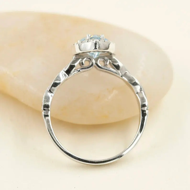 14K PEAR AQUAMARINE DIAMOND HALO TWIST RING