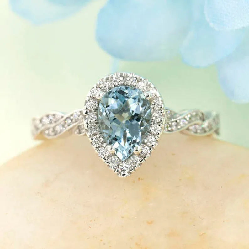 14K PEAR AQUAMARINE DIAMOND HALO TWIST RING