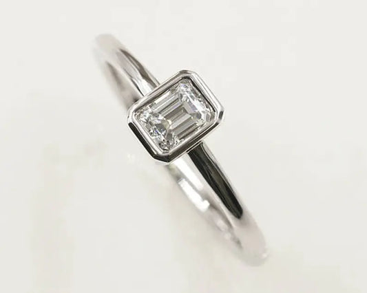 14K 0.30CT EMERALD CUT DIAMOND BEZEL SOLITAIRE RING