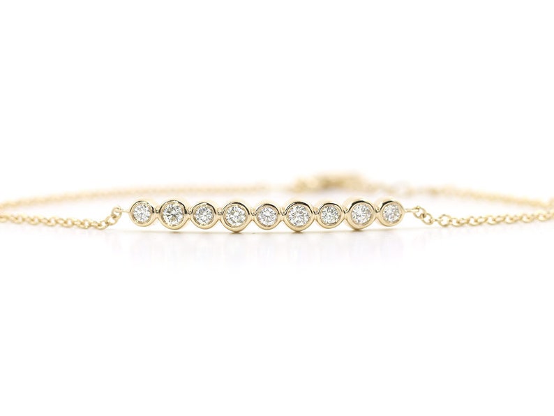 14K 9 DIAMOND BEZEL BAR BRACELET