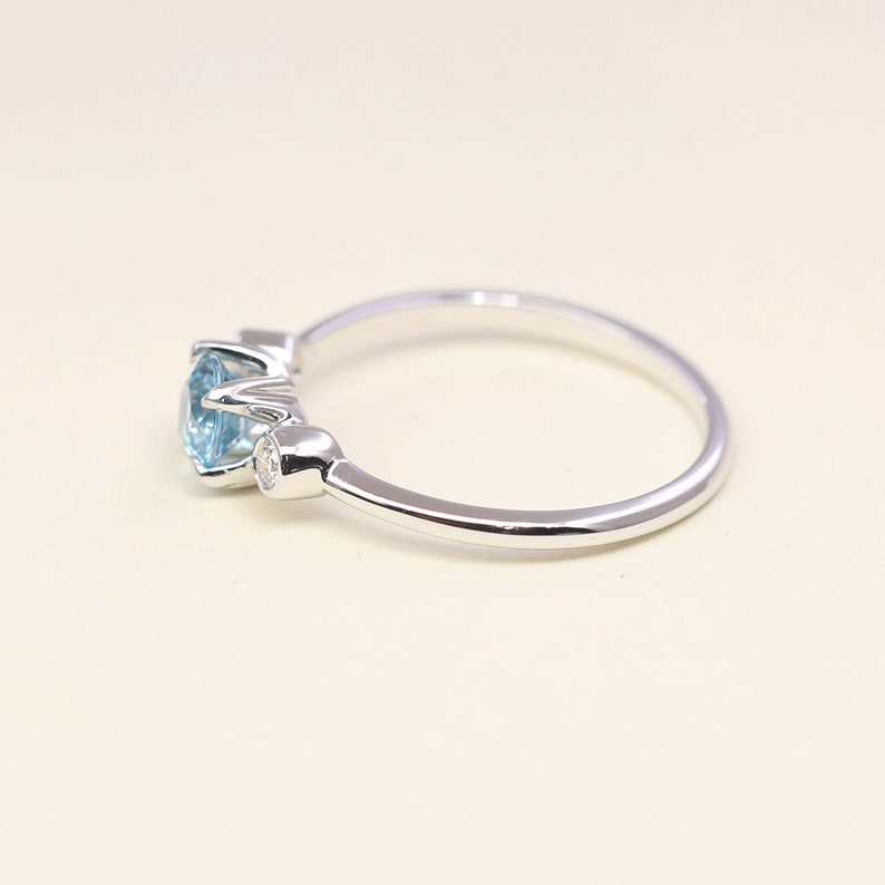 14K BLUE ZIRCON DIAMOND BEZEL RING