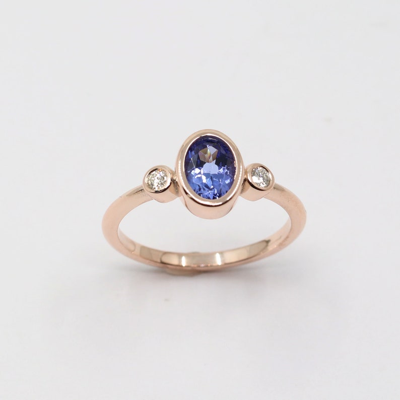 14K OVAL TANZANITE DIAMOND BEZEL RING