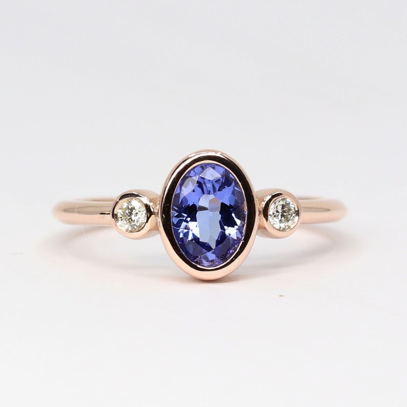 14K OVAL TANZANITE DIAMOND BEZEL RING