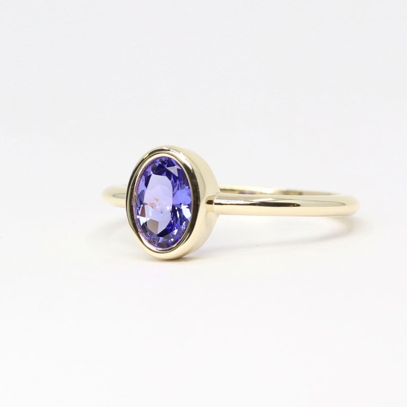 14K OVAL TANZANITE BEZEL SOLITAIRE RING