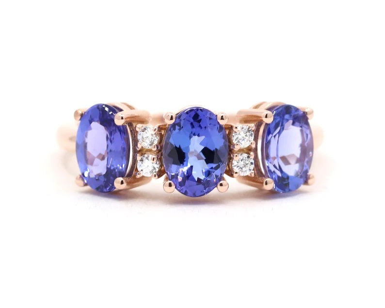 14K OVAL TANZANITE 4 DIAMOND BAND