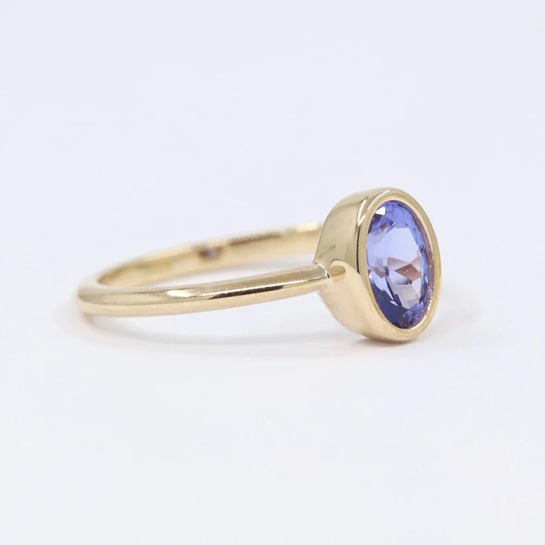 14K OVAL TANZANITE BEZEL SOLITAIRE RING