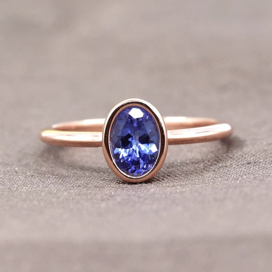 14K OVAL TANZANITE BEZEL SOLITAIRE RING